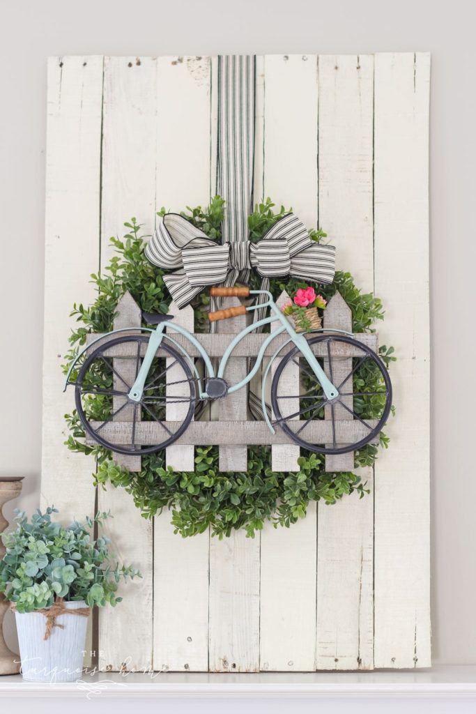 boxwood wreath with painted bicycle