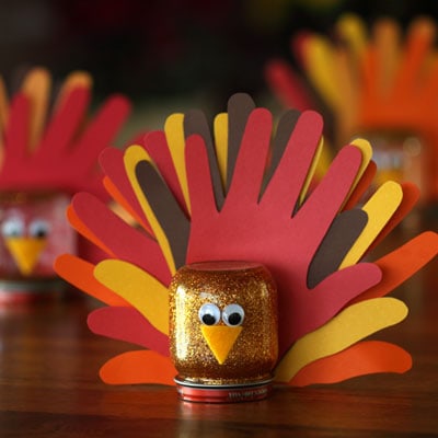 Get the kids to help with Thanksgiving table decorations with these handprint turkey crafts.
