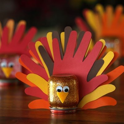 Get the kids to help with Thanksgiving table decorations with these handprint turkey crafts.