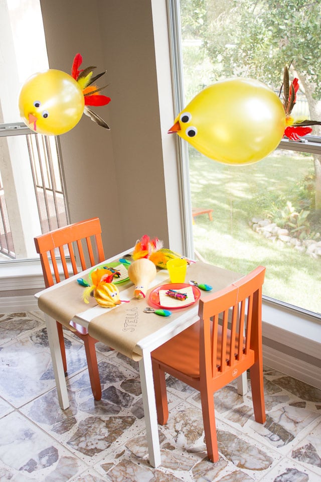 Recreate this Thanksgiving kids table setting, complete with adorable turkey ballons, for a special spot the kids will love.
