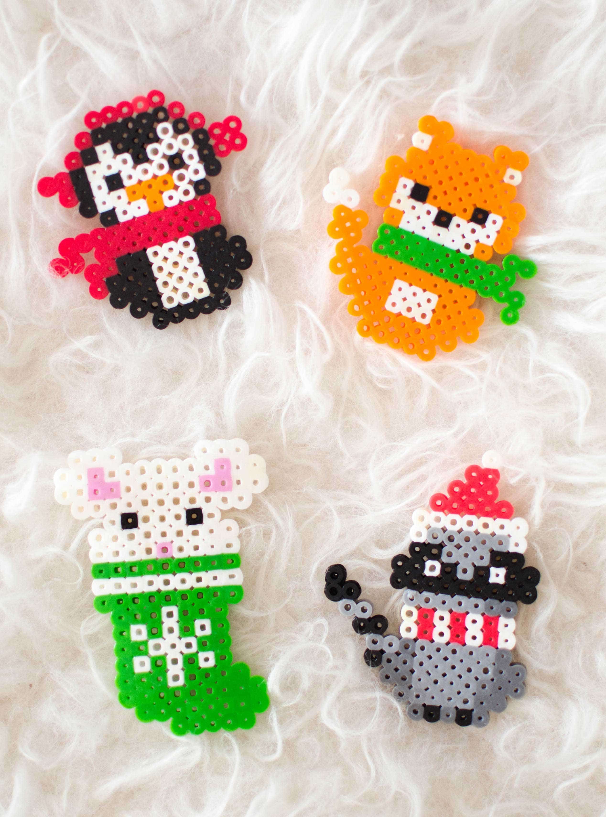 Make these adorable Christmas melty bead ornaments with our printable patterns. #KidsCraftIdeas #DIYChristmasOrnaments #PerlerBeadChristmasPatterns #