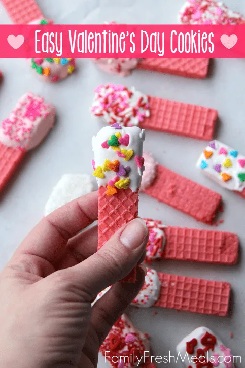 Chocolate dipped wafer cookies make a fun and easy Valentine's day treat for kids.