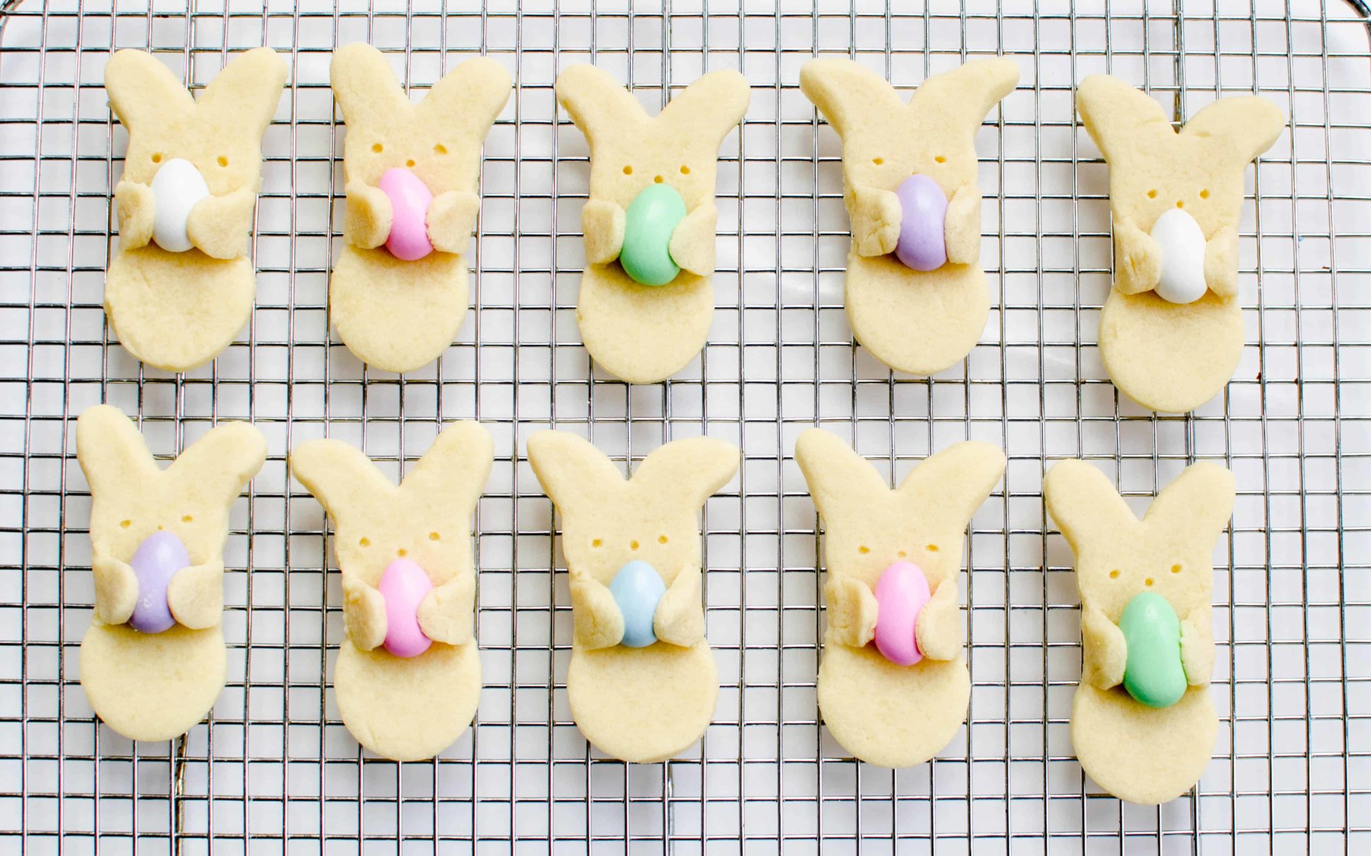 Cute bunny hug cookies on cooling rack