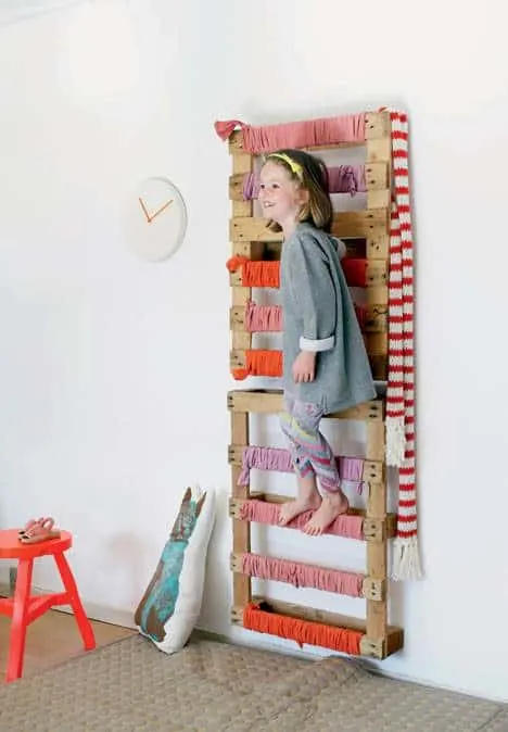 A wall-mounted pallet to add a climbing element to your kids indoor play space. 