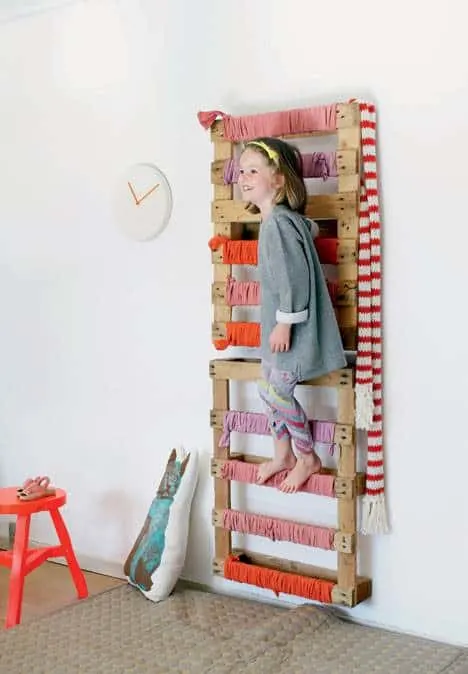 A wall-mounted pallet to add a climbing element to your kids indoor play space.