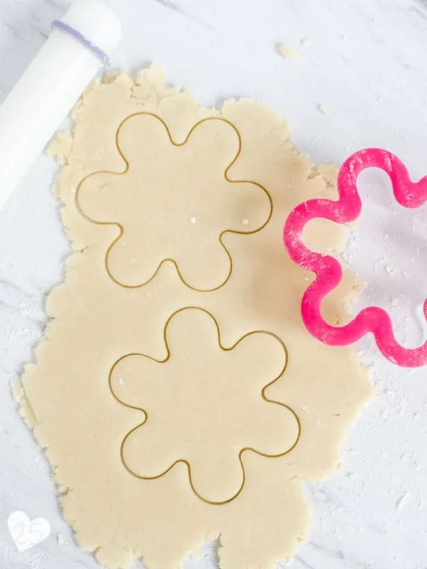 flower cookie cutter shape on cookie dough
