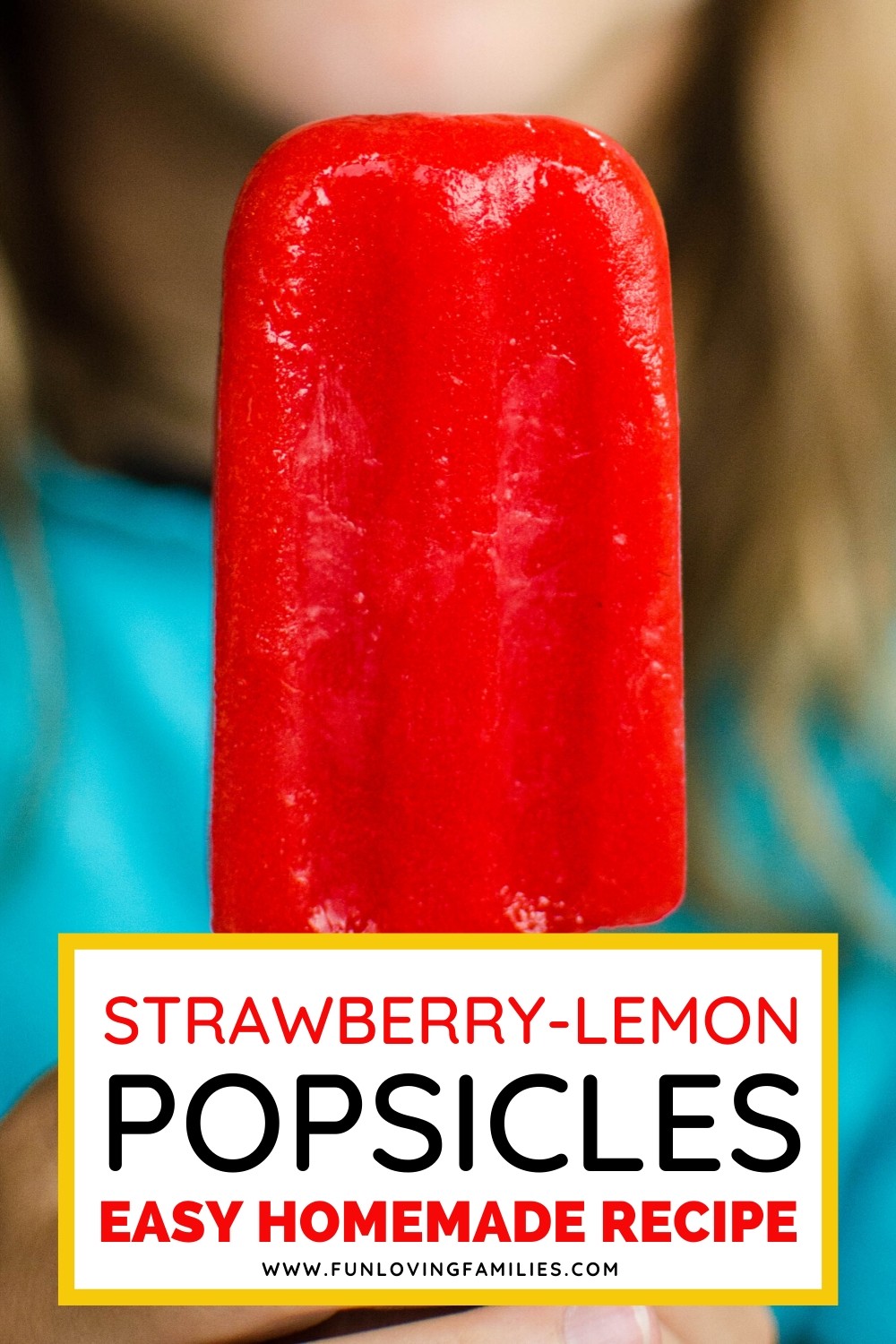 girl holding strawberry lemon ice pops