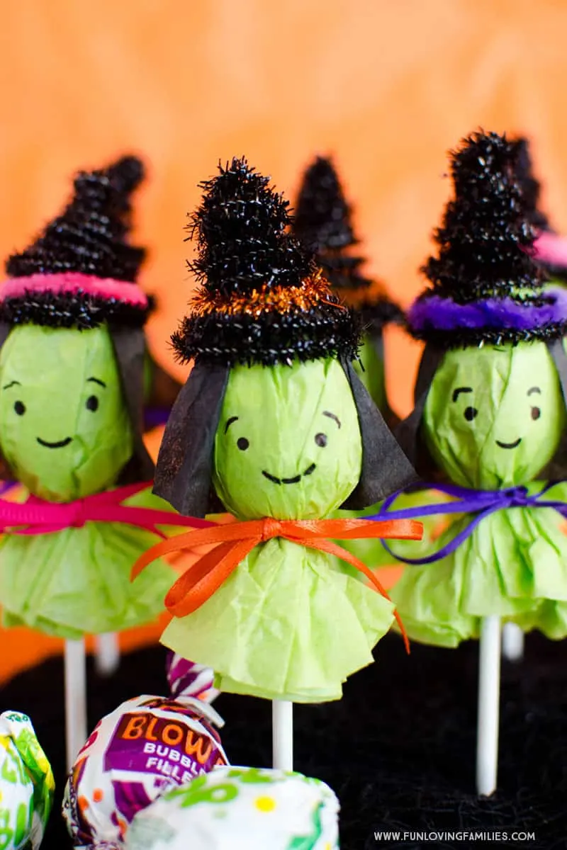 Turn a regular lollipop into a cute witch for Halloween party favors.