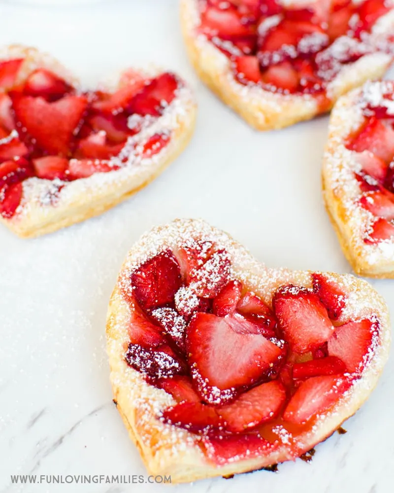 See how easy it is to make these puff pastry strawberry heart treats for the kids. 