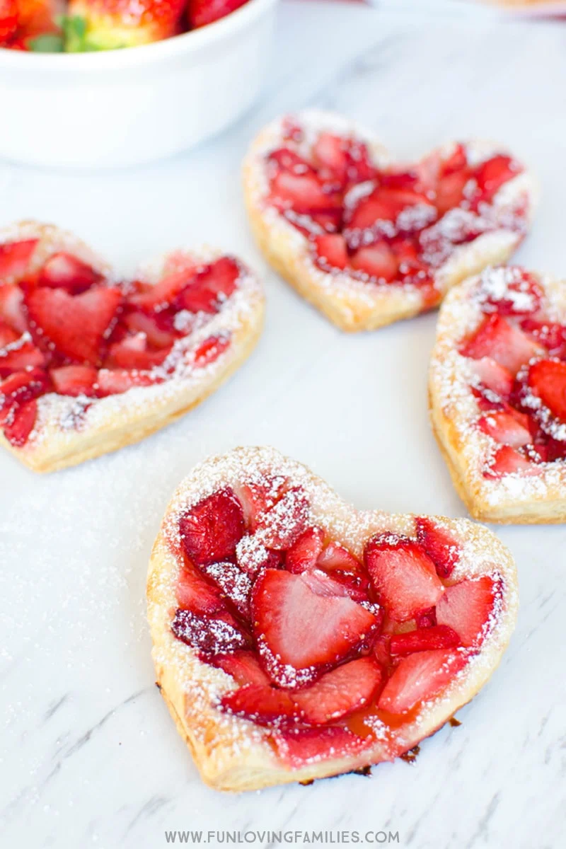 See how easy it is to make these Puff Pastry strawberry heart treats for the kids. Or let them join you in making them! They're great for breakfast, as an after school snack, or for dessert!