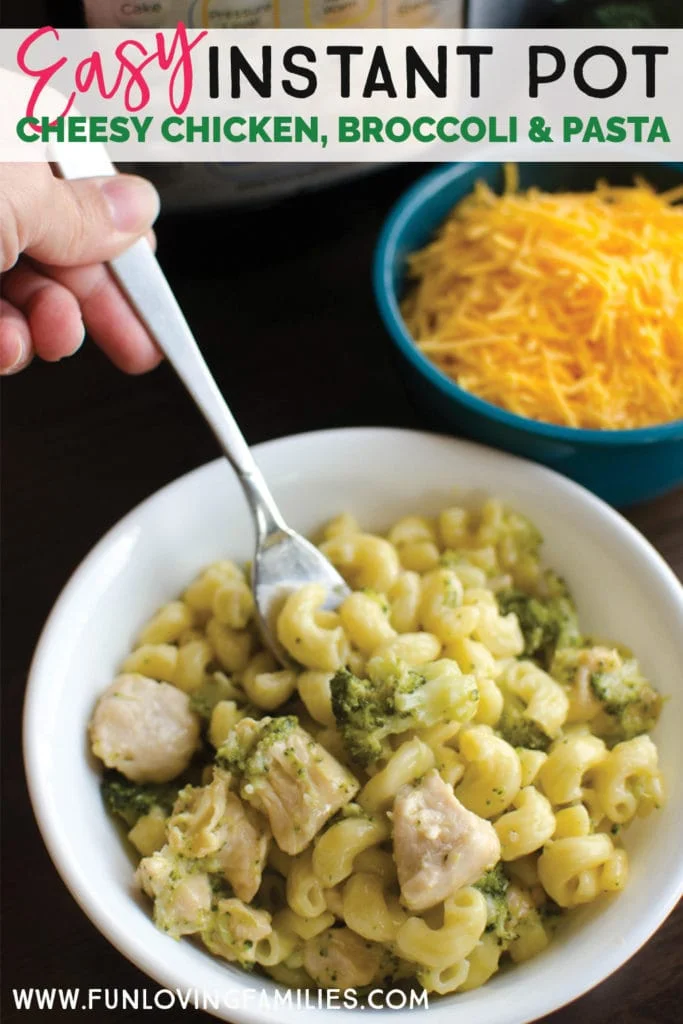 white bowl with cheesy elbow pasta and broccoli