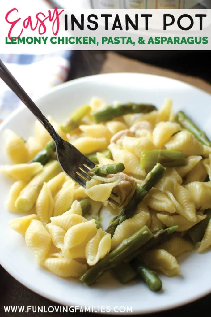 pasta shells with asparagus on white plate