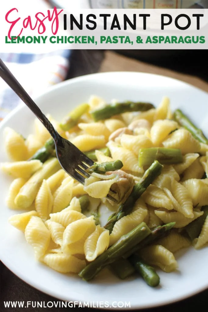 pasta shells with asparagus on white plate