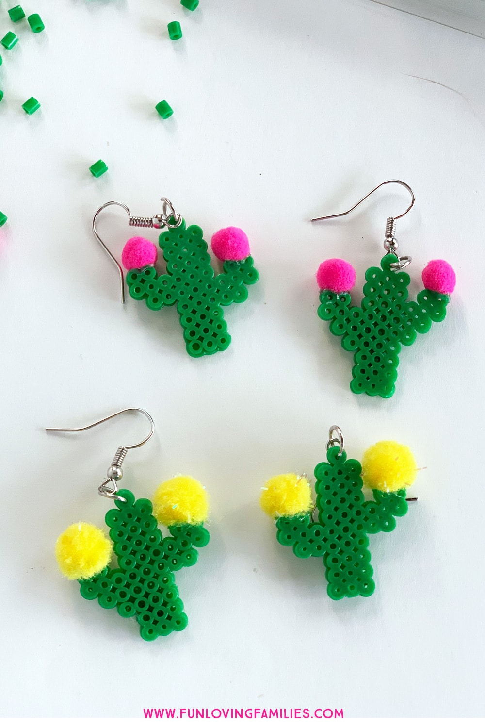 fuse bead earrings shaped like cacti with pom pom flowers