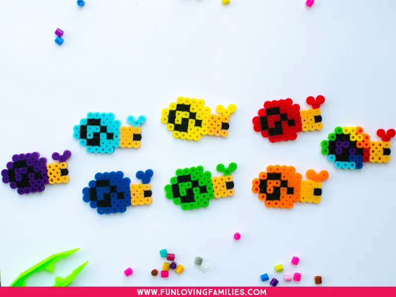 Perler bead snails in all colors of the rainbow