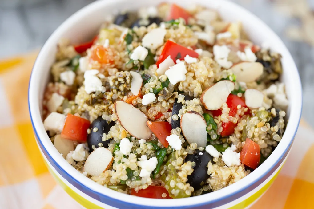 quinoa and veggies with almond slivers and olives
