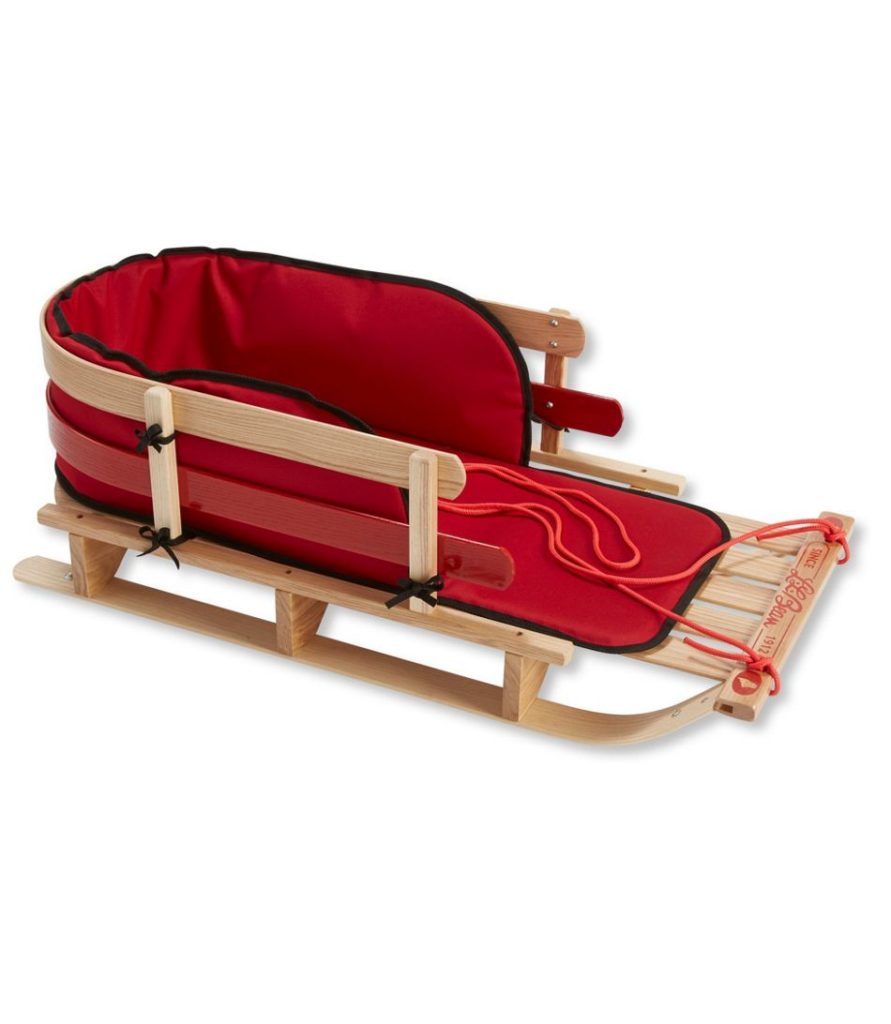 wooden toddler toboggan with red cushion and pull string