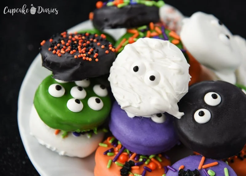 plate of dipped Oreo Halloween cookies