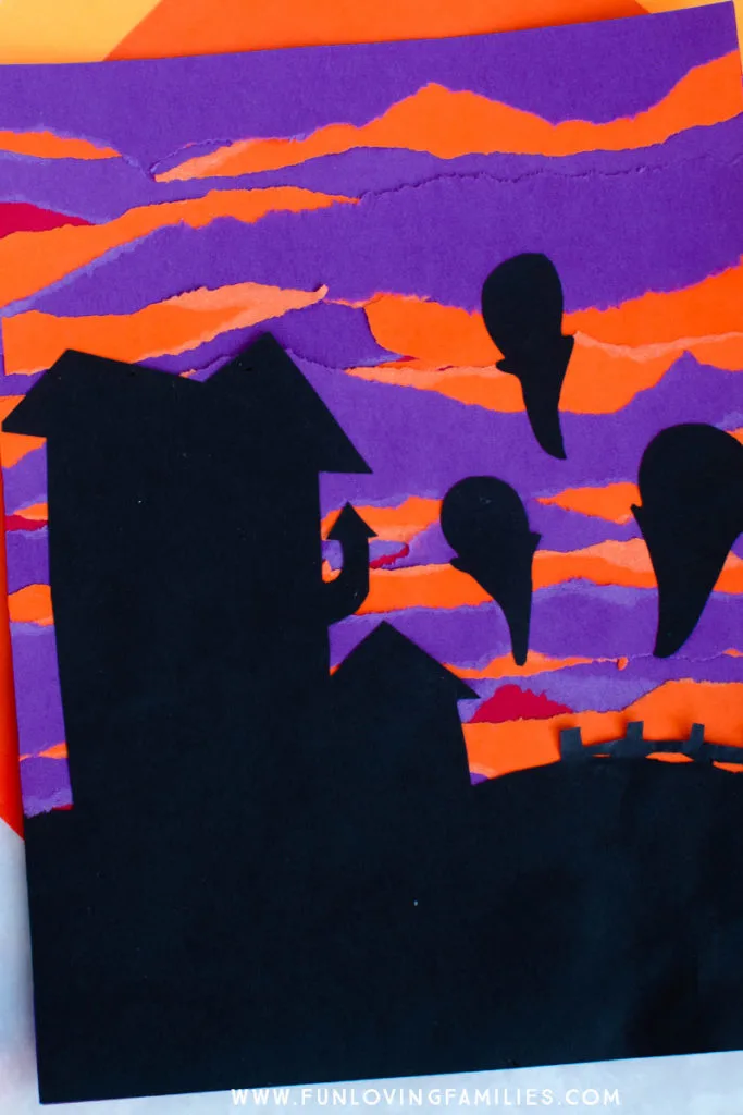 spooky scene with purple and orange torn paper background