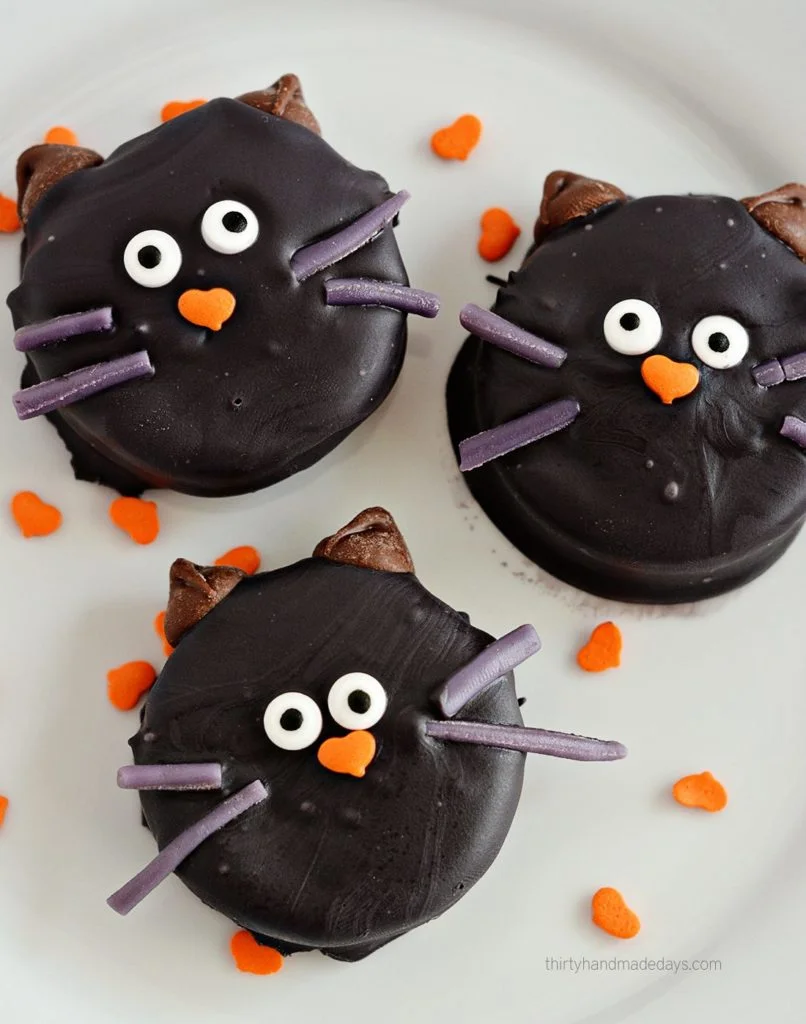 dipped oreo black cat cookies