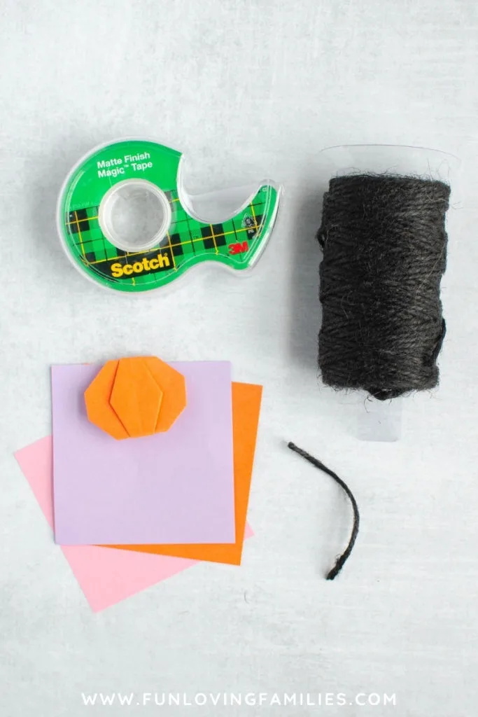 tape, black twine, and origami paper