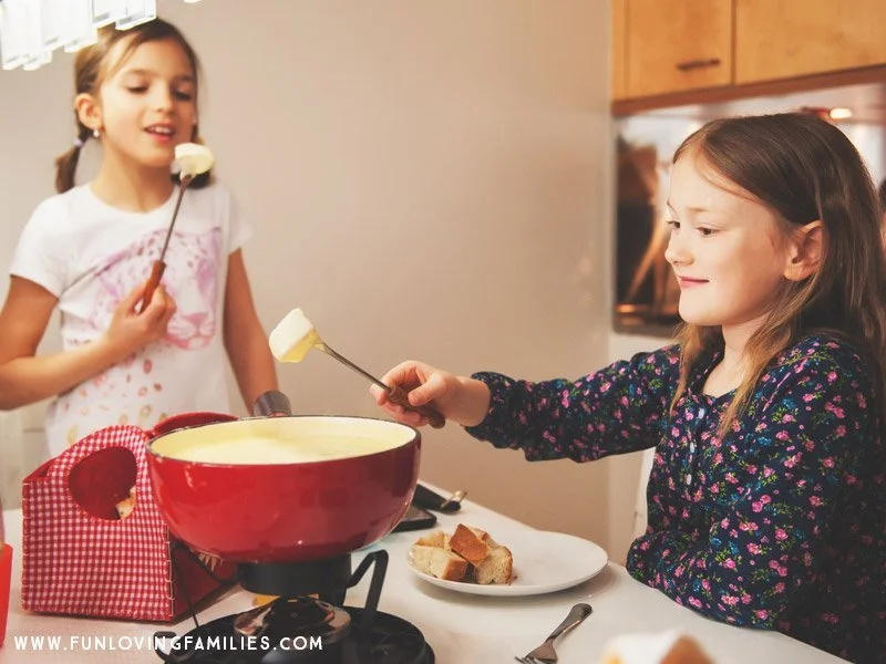 Kids eating fondue for Christmas Eve dinner