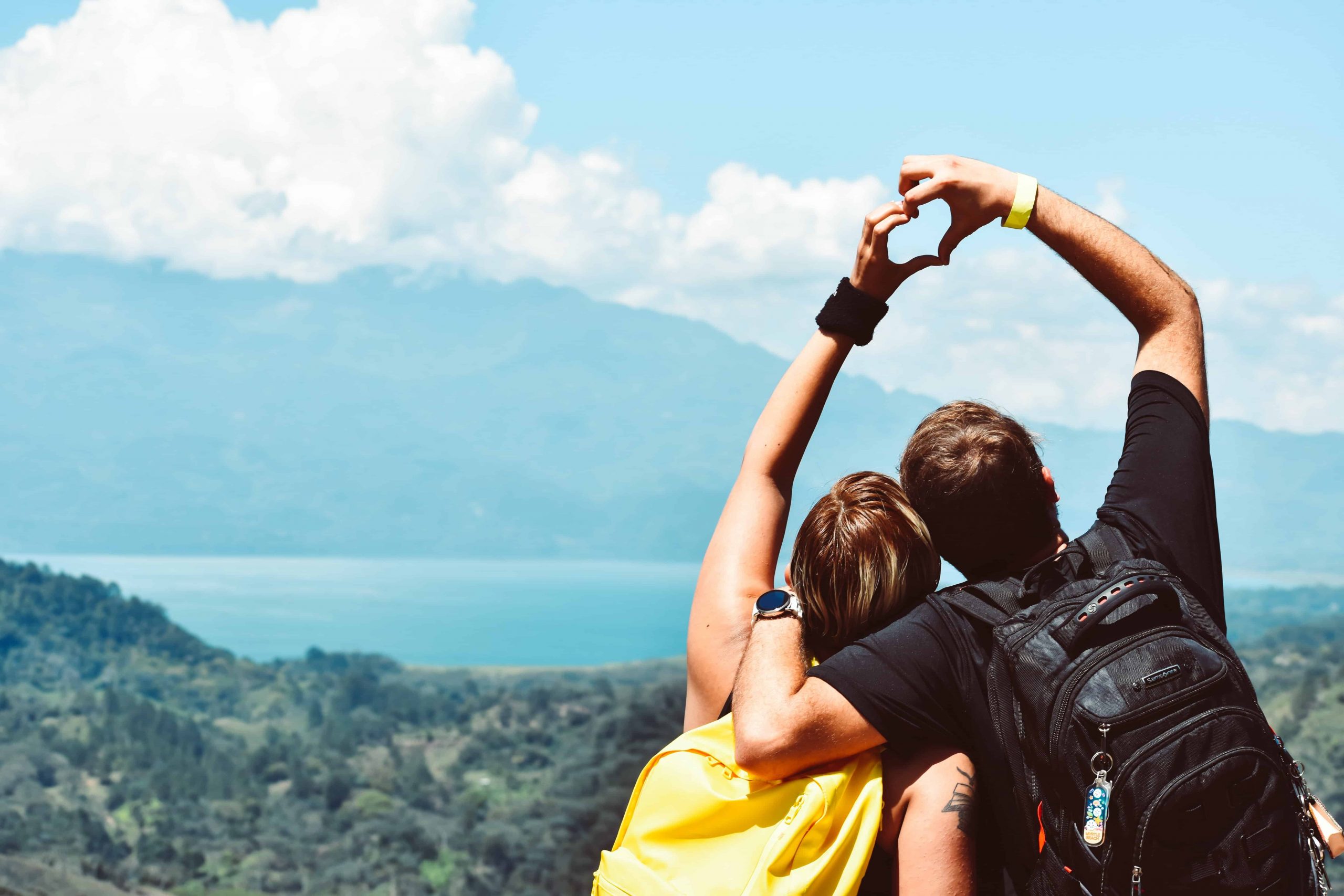 Couple having fun hiking during the summer