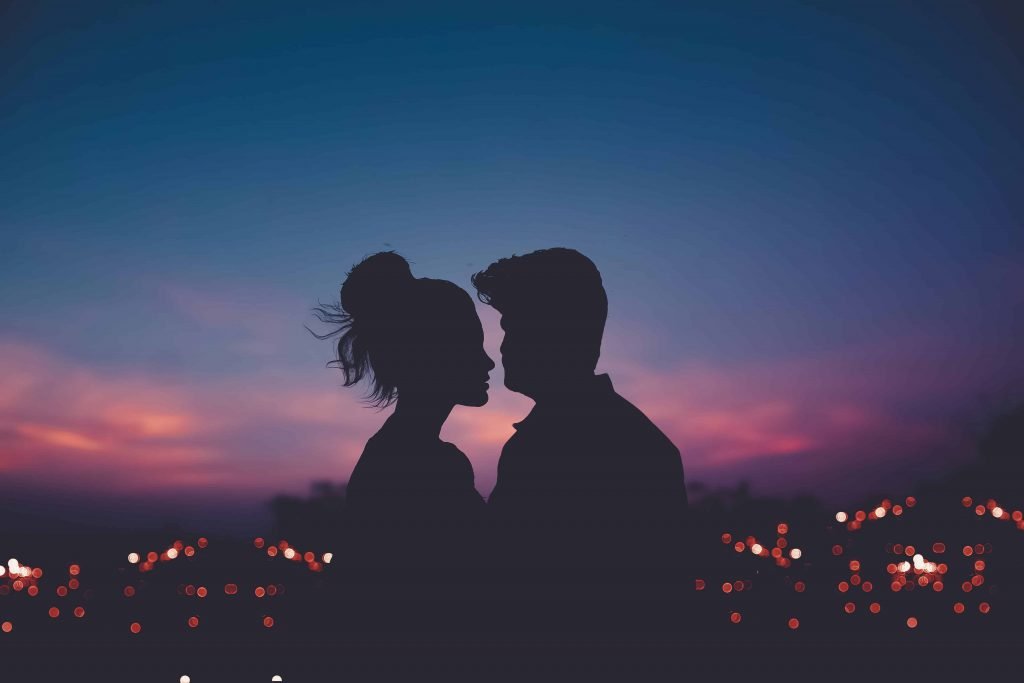 Couple enjoys a summer sunset together