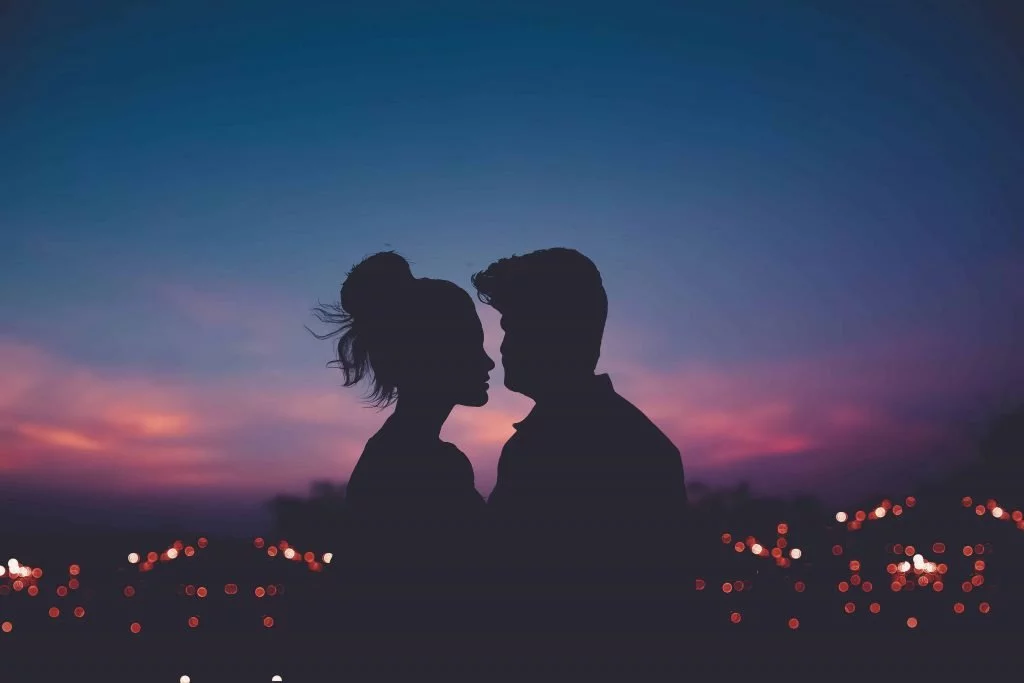 Couple enjoys a summer sunset together